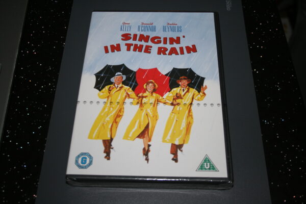 SINGIN` IN THE RAIN DVD BRAND NEW. CERT U.